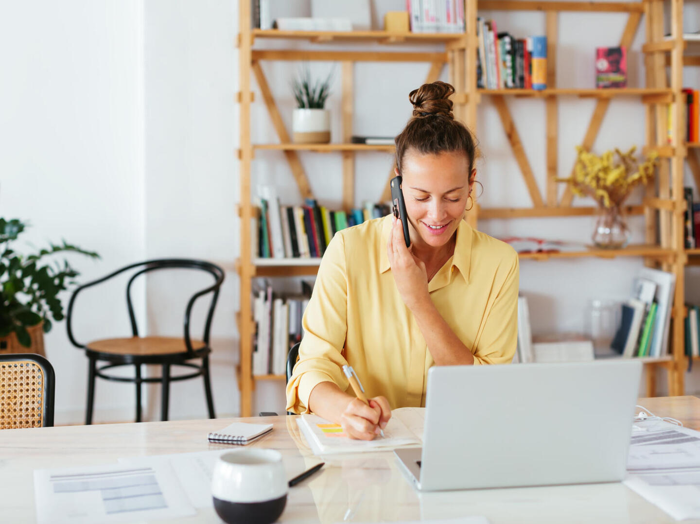 woman on phone at a desk