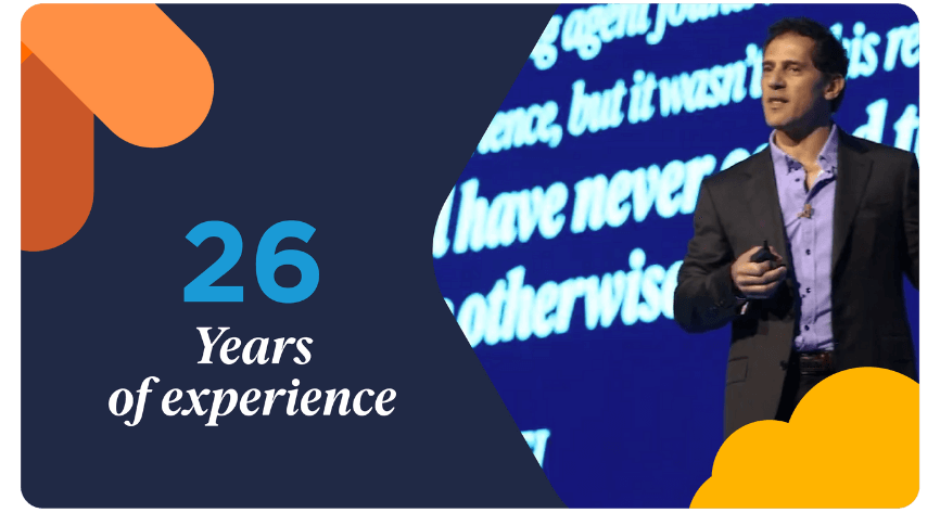 Bullhorn CEO Art Papas speaking at a conference alongside the text "26 Years of experience," illustrating why Bullhorn is the best staffing software for the recruitment industry.